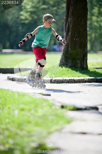 Image of Little boy on rollerblades