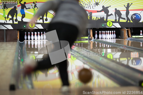 Image of Men bowling out of focus