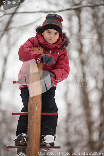 Image of Boy on the playground, winter day