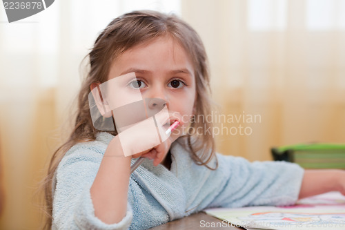 Image of Little girl with pencil