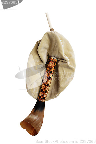 Image of close-up of  antique bagpipe over white background
