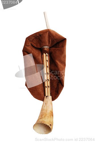 Image of close-up of  antique bagpipe from Scotland over white background
