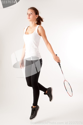 Image of Beautiful girl with a racket in hands