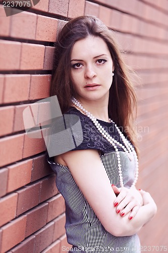 Image of Girl near the wall