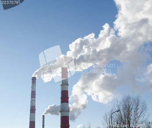 Image of smoke rise industry factory chimneys heat blue sky 