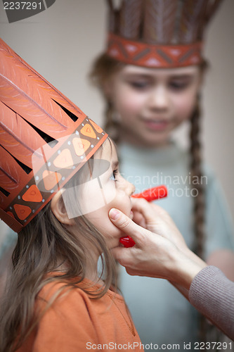Image of Little girls preparing to play Indians