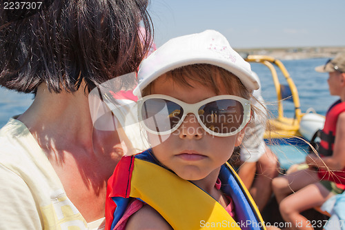 Image of Little girl in life jacket