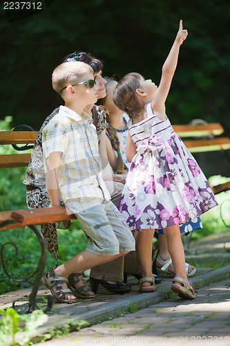 Image of Little girl pointing up
