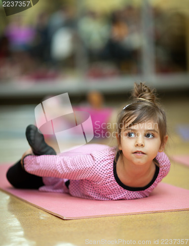 Image of Little girl stretching