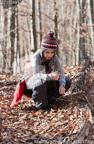 Image of Child in winter forest