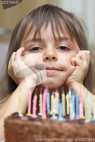 Image of Smiling girl and birthday cake