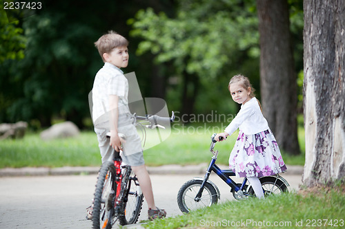 Image of Siblings riding bicycles