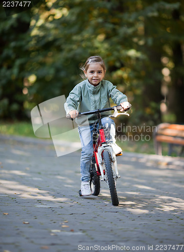 Image of Little girl riding bike