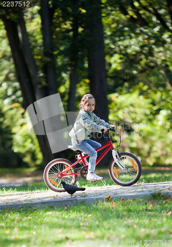 Image of Little girl riding bike