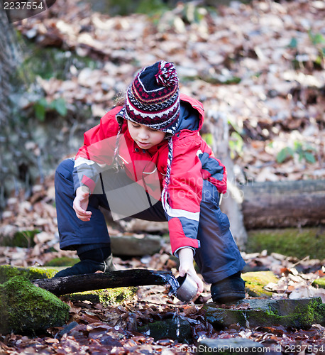 Image of Child taking water from spring