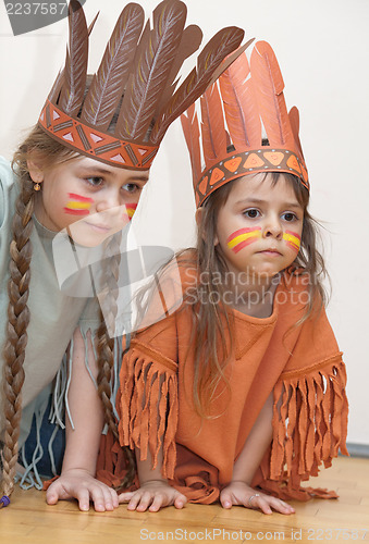 Image of Two little girls playing Indians
