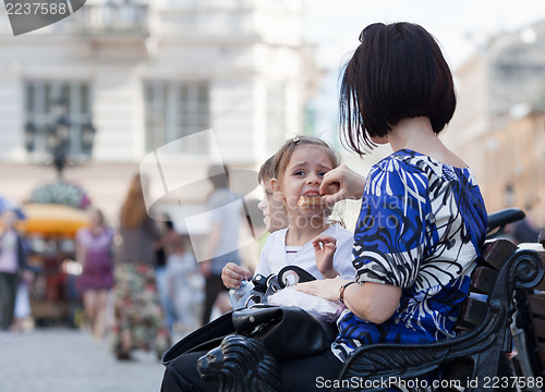 Image of Mom feeding her daughter