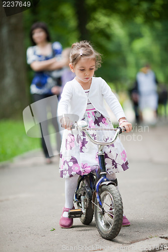 Image of Cute little girl on bike