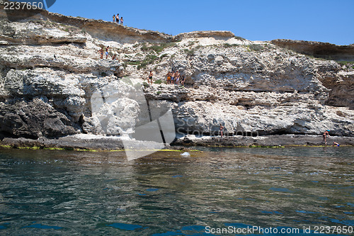 Image of Children on rocky cliffs