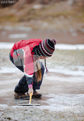 Image of Cleaning  the ice from snow on rink