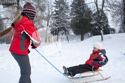 Image of Children having fun in winter park