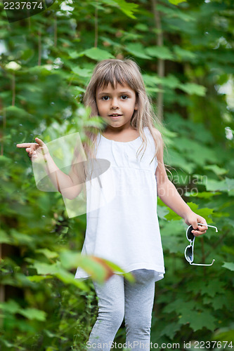 Image of Little girl in the forest