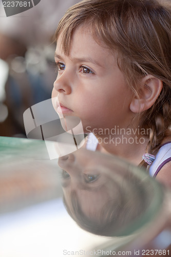 Image of Portrait of little girl with her reflection