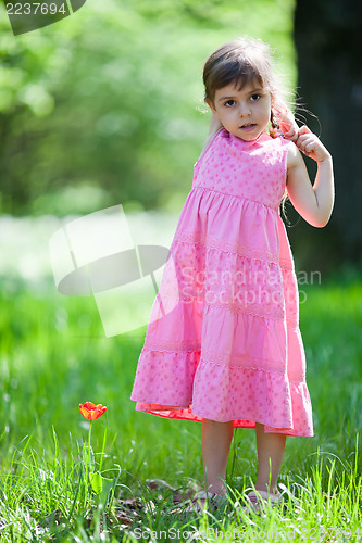 Image of Beautiful little girl and tulip