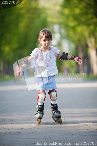 Image of Little girl on roller skates