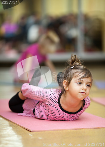 Image of Little girl stretching