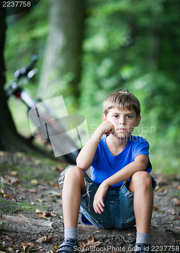 Image of Little cyclist resting