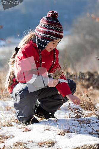 Image of Child on the meadow in winter