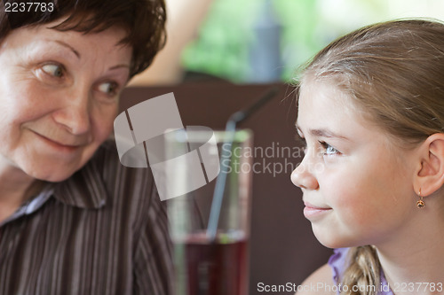 Image of Grandma smiling to her granddaughter 