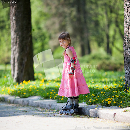 Image of Little girl on roller skates