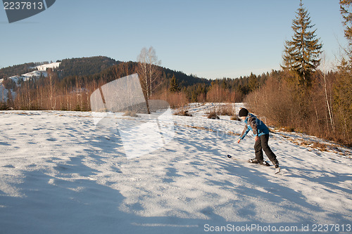 Image of Climbing up on skis