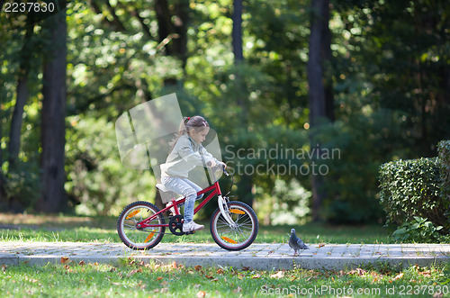 Image of Little girl riding bike