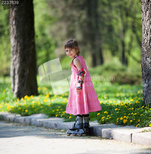 Image of Little girl on roller skates