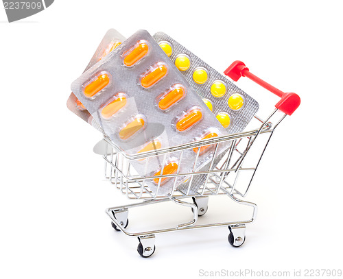 Image of Multicolored pills packs in shopping cart