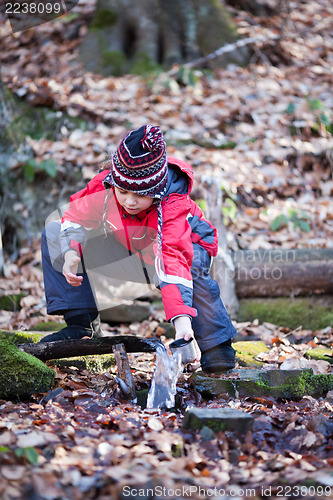 Image of Child taking water from spring