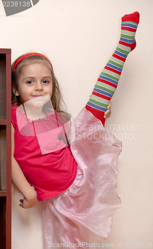 Image of Little girl doing stretching