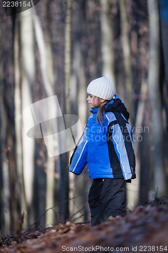 Image of Cute little girl in the forest