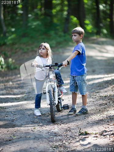 Image of Children with a bicycle
