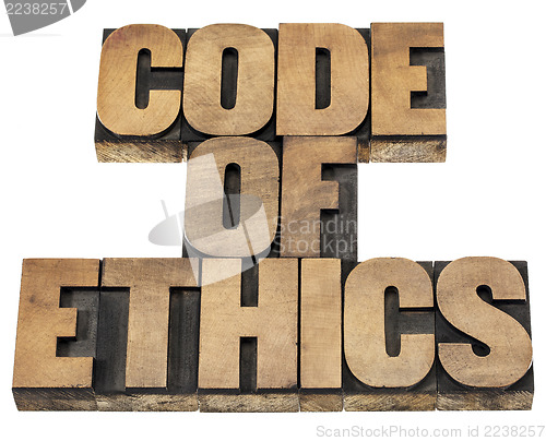 Image of code of ethics in wood type