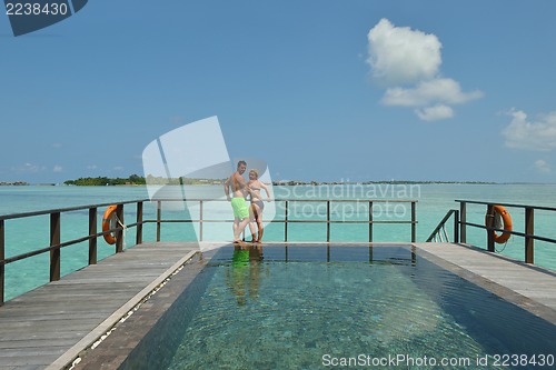 Image of happy young  couple at summer vacation have fun and relax at bea