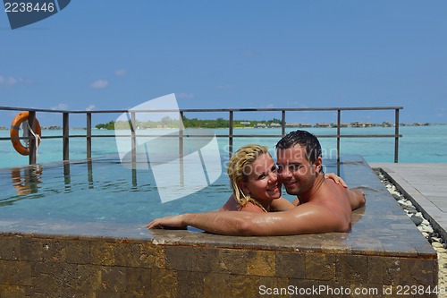 Image of happy young  couple at summer vacation have fun and relax at bea