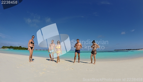 Image of group of happy young people have fun on bach