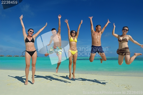 Image of group of happy young people have fun on bach