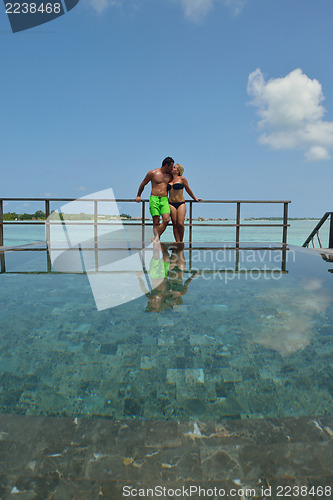 Image of happy young  couple at summer vacation have fun and relax at bea