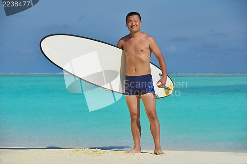 Image of happy young  couple enjoying summer on beach