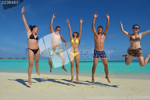 Image of group of happy young people have fun on bach